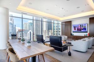 a living room with a table and a large window at River N 1BR w Gym WD nr Mag Mile by Bluegound CHI-127 in Chicago