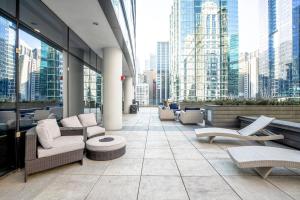 a lobby with chairs and tables in a building at Loop 1BR w Gym Pool nr Financial District CHI-233 in Chicago