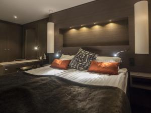 Postel nebo postele na pokoji v ubytování Laponia Hotell & Konferens