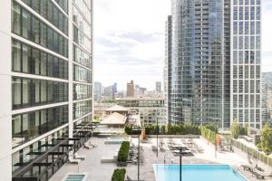 a view of a city from a building with a pool at S Loop 1BR w Pool Gym Spa nr Grant Park CHI-741 in Chicago
