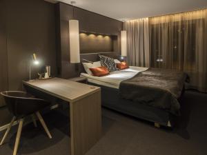 Postel nebo postele na pokoji v ubytování Laponia Hotell & Konferens