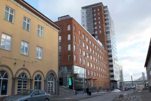 a car is parked in front of a building at MM City Apartment Next to Arena in Tampere