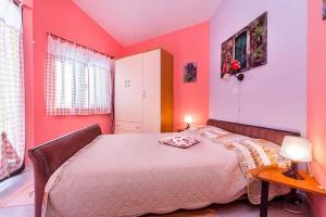 Postel nebo postele na pokoji v ubytování Apartments Bardak