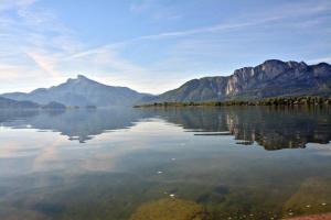 a large body of water with mountains in the background at Haus Bachinger in Mondsee