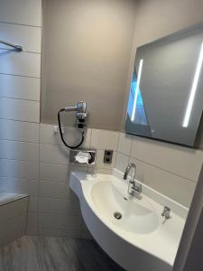 Ein Badezimmer in der Unterkunft Hotel MyLord
