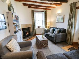 Posezení v ubytování Corner Cottage