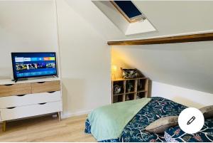 Postel nebo postele na pokoji v ubytování Le Studieux Abbevillois