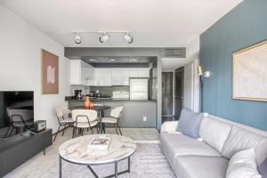 a living room with a couch and a table at Pasadena 2BR w Gym Pool nr Colorado Ave LAX-864 in Pasadena