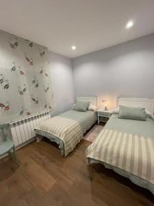 A bed or beds in a room at Casa La Rosada