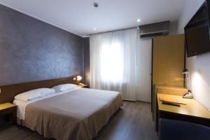 Postel nebo postele na pokoji v ubytování Hotel San Giorgio