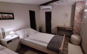 Posteľ alebo postele v izbe v ubytovaní Palatinus Apartman Esztergom