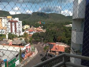 a view of a city through a fence at APARTAMENTO AGUAS DA SERRA 713 A in Rio Quente +2 photos