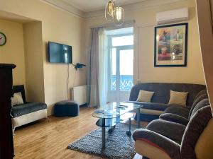 a living room with a couch and a table at Apartment in Old Tbilisi Orbeliani Square in Tbilisi City