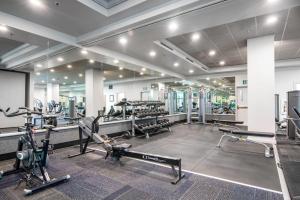 a gym with treadmills ellipticals and exercise equipment at Telegraph Hill Studio wSpa nr Coit Tower SFO-38 in San Francisco