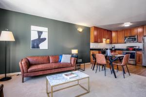 a living room with a couch and a table at N Beach 1BR w Pool Fitness Center nr Muni SFO-233 in San Francisco