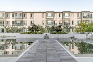 a walkway in front of a building at N Beach 1BR w Pool Fitness Center nr Muni SFO-233 in San Francisco