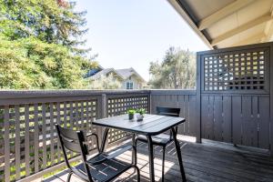 a patio with a table and chairs on a deck at Cupertino 1BR w Pool Gym AC nr shops SFO-371 in Cupertino