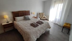 Postel nebo postele na pokoji v ubytování Apartaments rurals CAL PARRO, Batea (Terra Alta)