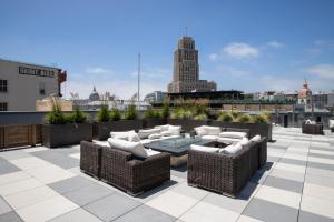 a patio with a table and chairs on a roof at SoMa 1BR w WD Rooftop nr BART Muni SFO-461 in San Francisco