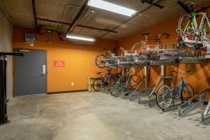 a row of bikes on racks in a room at SoMa 1BR w WD Rooftop nr BART Muni SFO-461 in San Francisco