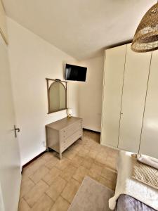 TV a/nebo společenská místnost v ubytování Casa Gladioli con Ampio Giardino