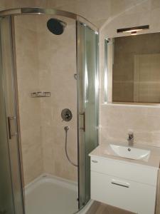 a bathroom with a shower and a sink at Apartments Lavanda in Budva +39 photos
