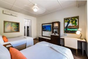 Voodi või voodid majutusasutuse Margaritaville Beach Resort Playa Flamingo toas