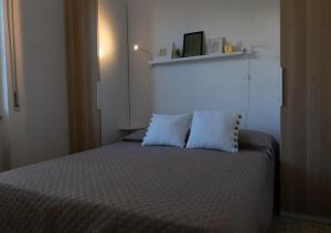 A bed or beds in a room at Villa Marisole