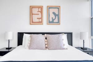 a bedroom with a white bed with two lamps at Redwood City 1BR w Gym WD nr Caltrain SFO-918 in Redwood City