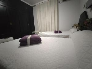 A bed or beds in a room at Hostal New York City