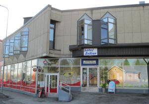 a store front of a building with glass windows at Hotel Ackas in Toijala