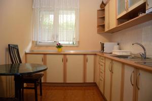 a small kitchen with a table and a window at Villa Diana in Sozopol