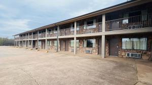 an empty parking lot in front of a building at Cattle country lodge in Stroud