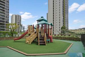 a playground with a slide in a city at Nalu Malu 1 Bedroom @Waikiki Banyan 1 Free Parking in Honolulu