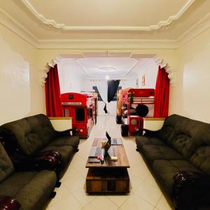 a living room with two couches and a fire truck at CocaCosa in Casablanca