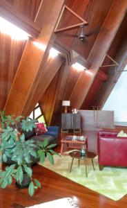 a living room with a couch and a table at Riverview Mid Century Modern Church in Innisfail