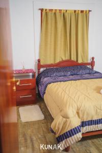 Ένα ή περισσότερα κρεβάτια σε δωμάτιο στο kunak