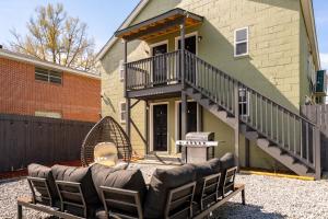 a couch in a yard in front of a house at Cozy 1 bed APT near Five Points! Bring your pets! in Columbia