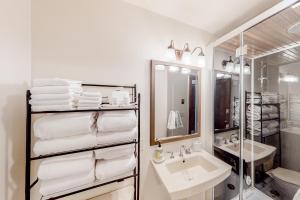 a white bathroom with a sink and a mirror at Ideal in Idaho in Ketchum +26 photos