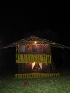 a small house with a yellow caution tape around it at glamping/cabañas Monaco in Santa Rosa de Cabal