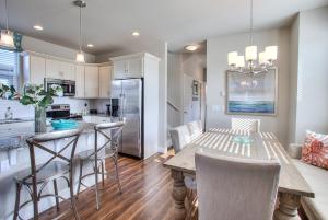 a kitchen and dining room with a table and chairs at Just Beachy in Ocean Shores