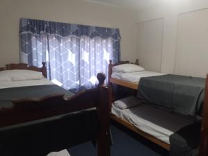 מיטה או מיטות בחדר ב-La tranquila termal