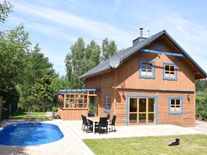 a house with a pool in front of it at Large holiday villa with sauna, jacuzzi and pool in Perlino