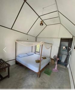 a bedroom with a bed in a tent at Koh Ngai Seafood in Ko Ngai