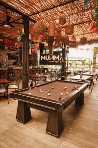 a pool table with balls on it in a restaurant at Nomads Hotel & Rooftop Pool Cancun in Cancún