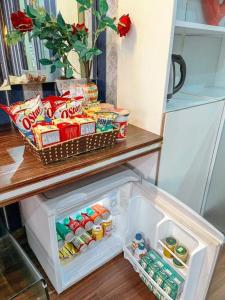 an open refrigerator with food and drinks in it at My House Hotel - 350 Trần Khát Chân - by Bay Luxury in Hanoi