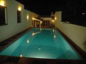 a swimming pool in a house at night at Villa del Mar in Mactan
