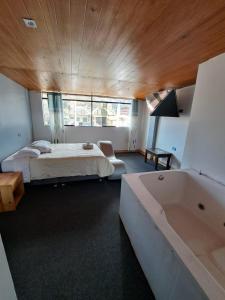 Cama o camas de una habitación en Hotel Alpamayo Guest House