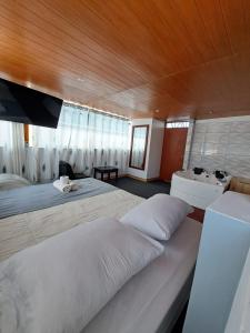Cama o camas de una habitación en Hotel Alpamayo Guest House