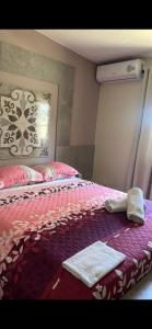 Rúm í herbergi á Curasita Colour Appartments & Resort - adres kaya Sucre nst 282